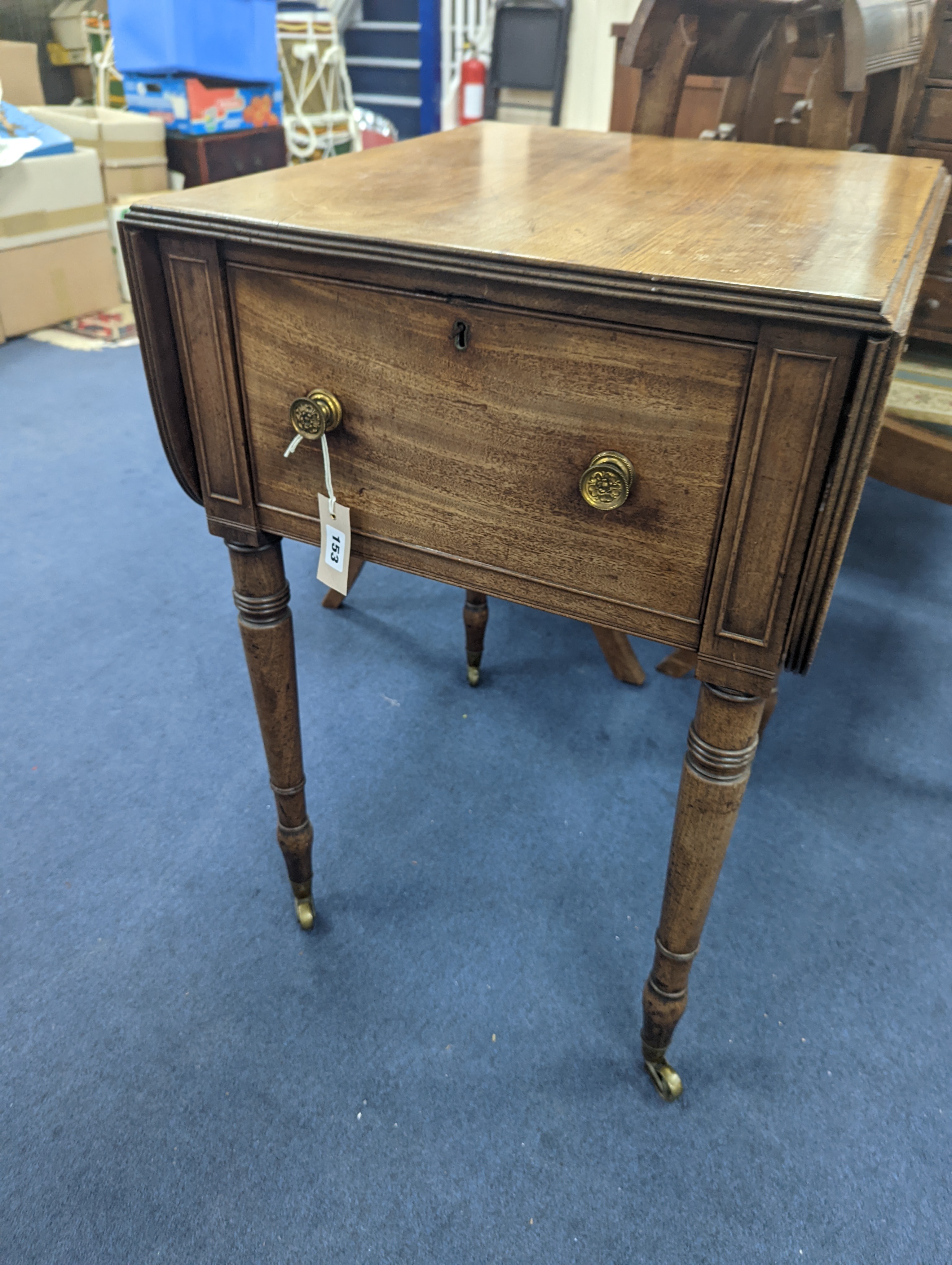 A Regency mahogany drop flap work table with twin fall compartments, width 48cm, depth 54cm, height 71cm